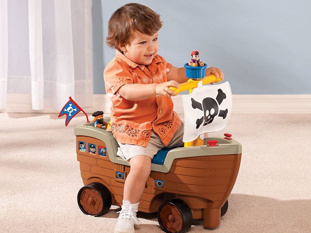 Little boy riding the Little Tikes Pirate Ride On