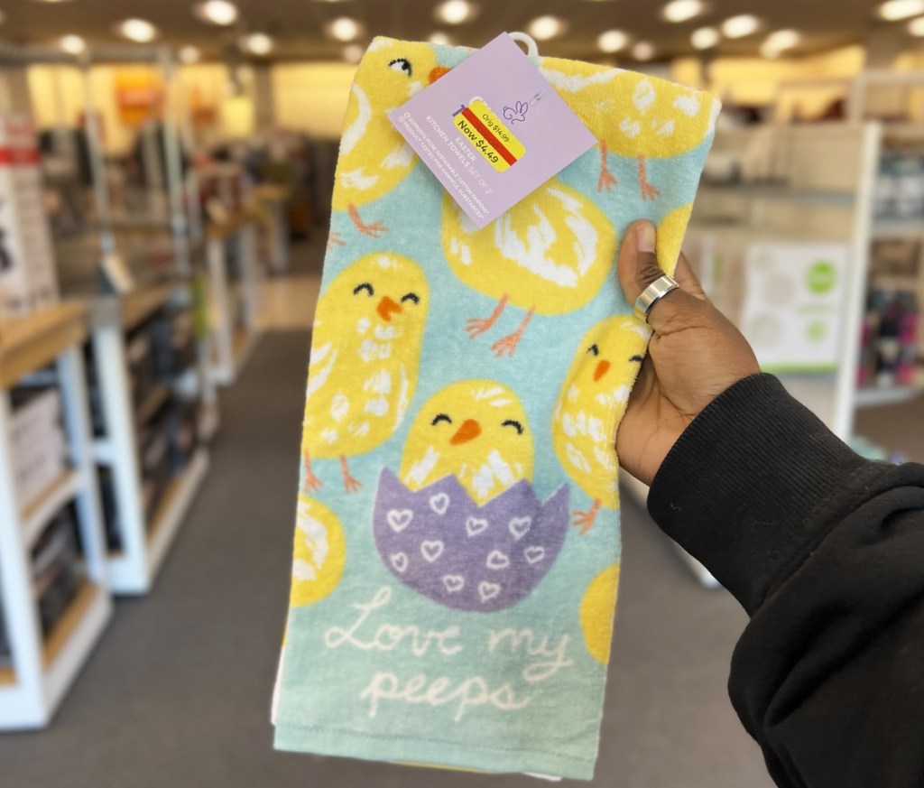 hand holding up easter chicken print kitchen towels