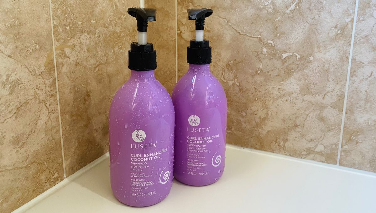 Bottles of Luseta shampoo and conditioner in shower.