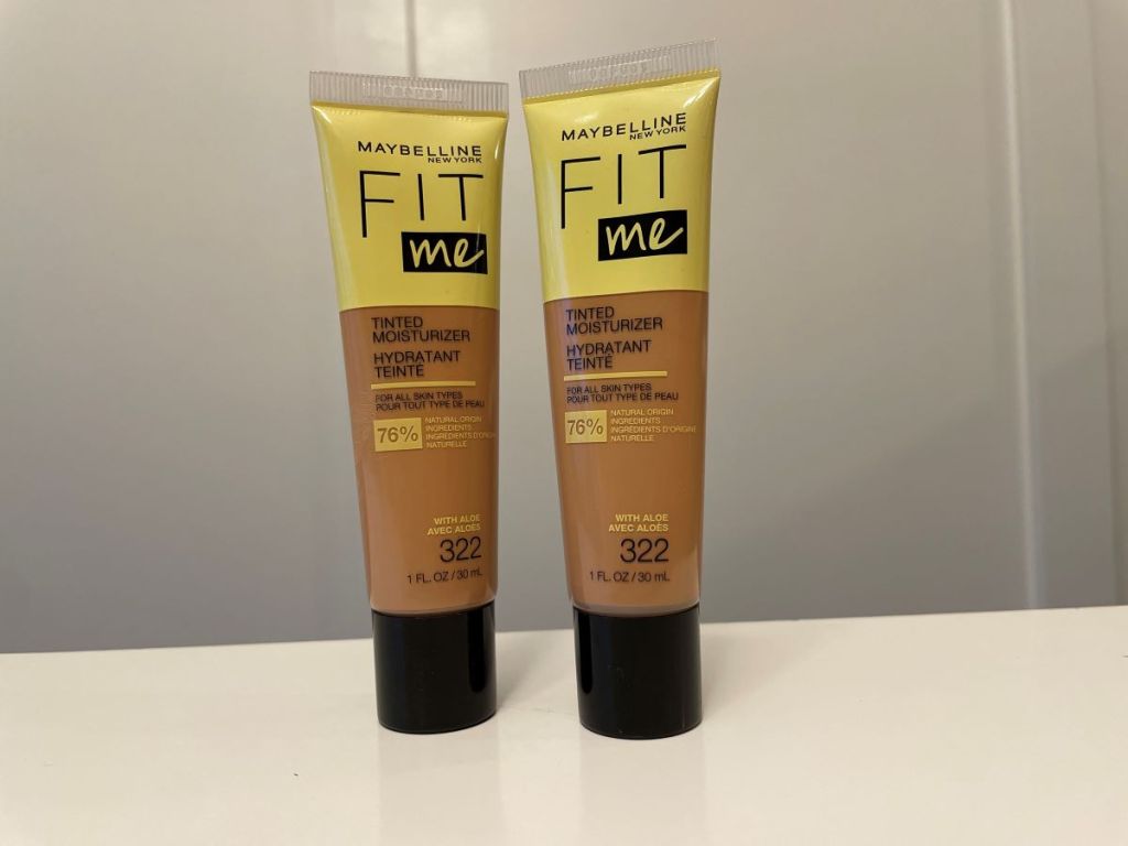 Two tubes of Maybelline tinted moisturizer on a table