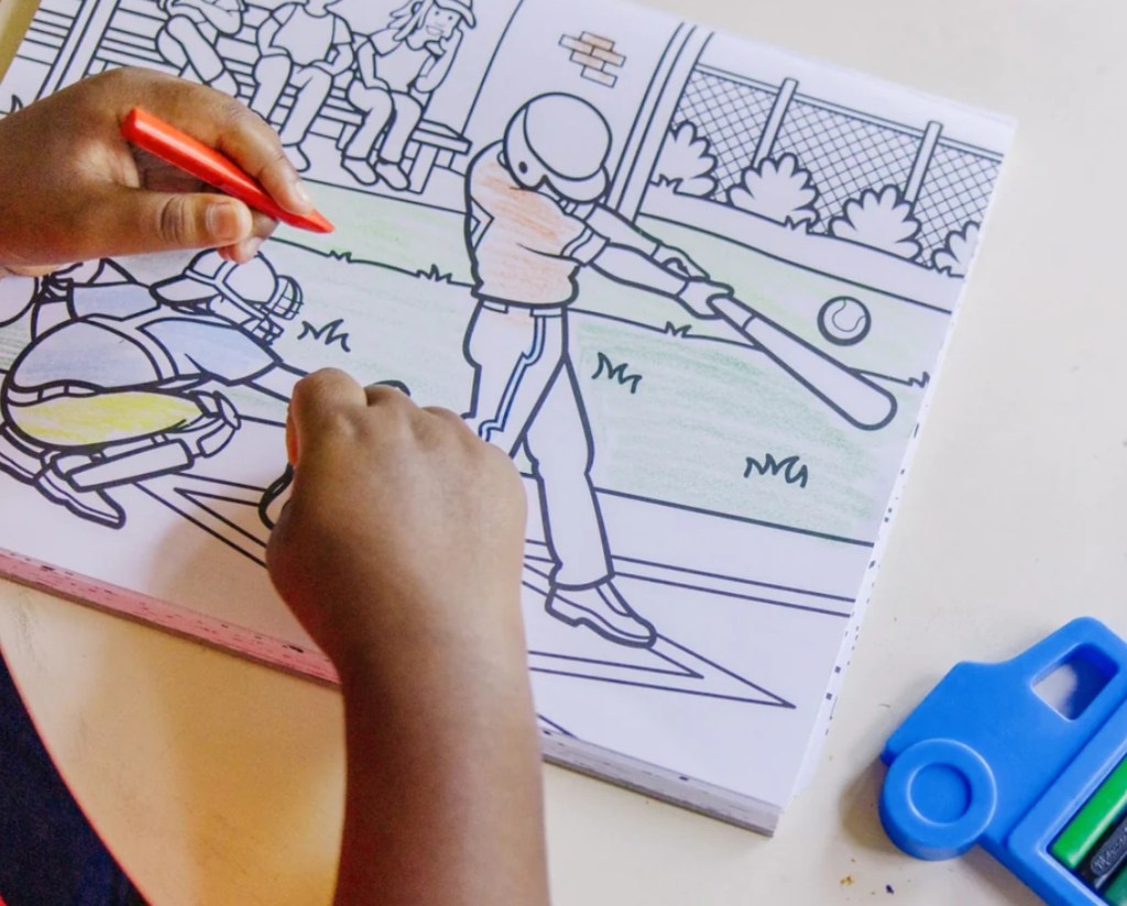 kid coloring on a coloring page with a kid playing baseball