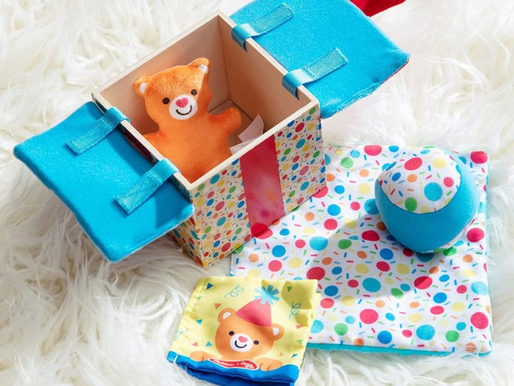 box with sensory toys in and surrounding it