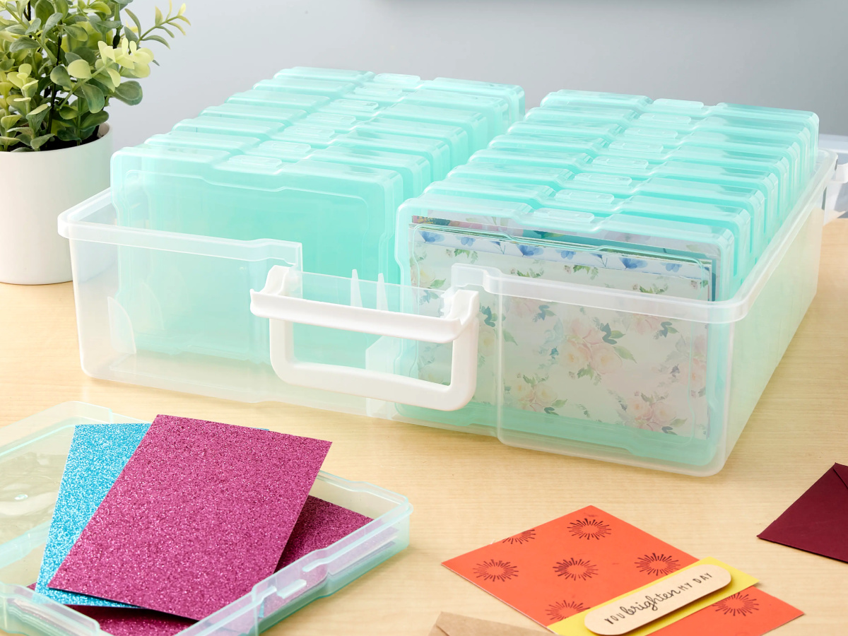 mint colored storage containers filled with cards