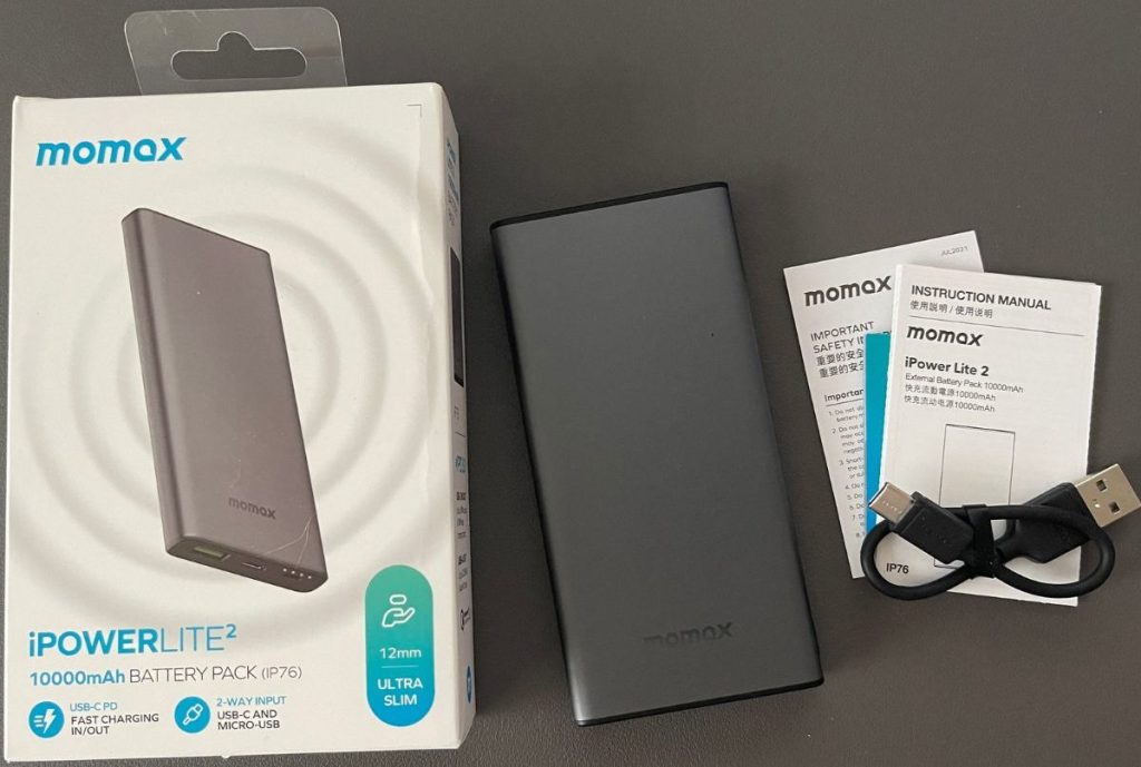 Momax Slim Charger with contents of packaging laid out including an instructions manual and USB cable.