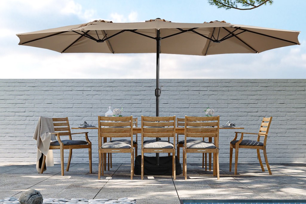 large patio umbrella covering entire outdoor dining set