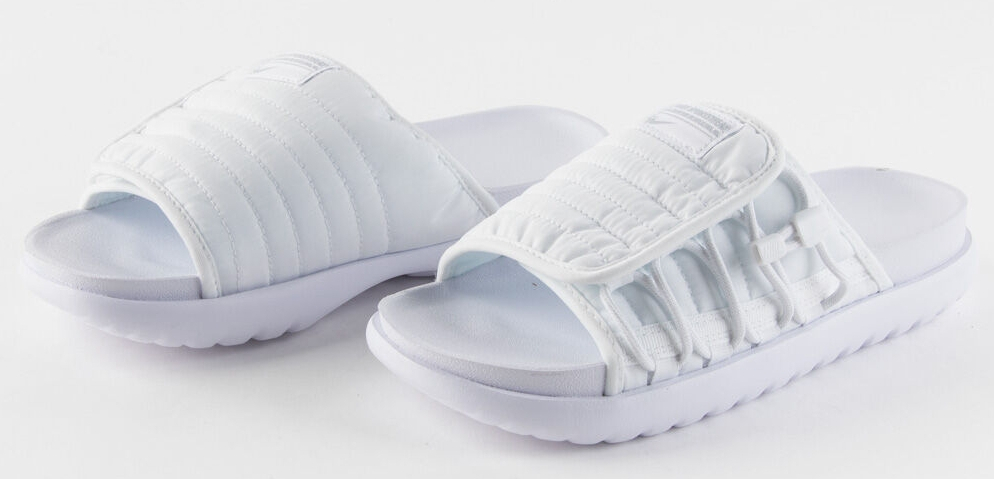 Pair of solid white Nike slide sandals
