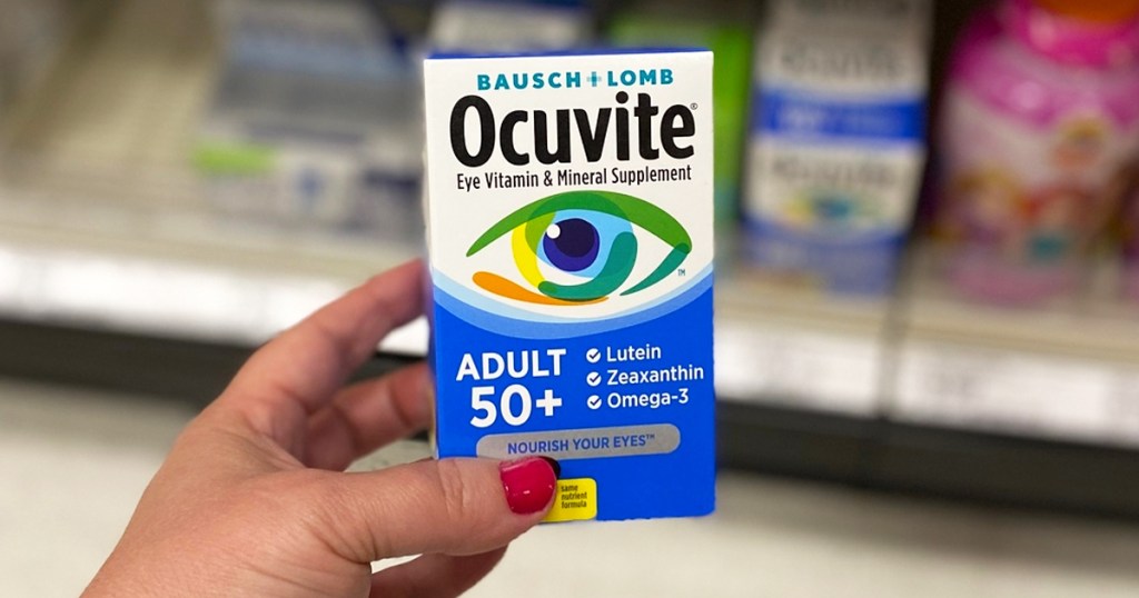hand holding box of ocuvite eye supplement