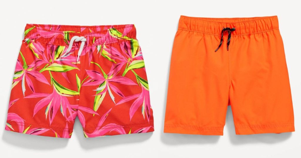 A floral pair of swim shorts and an orange pair of swim shorts