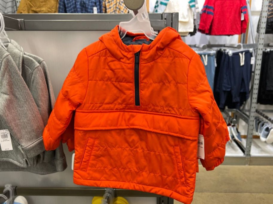 orange toddler boys jacket hanging at Old Navy