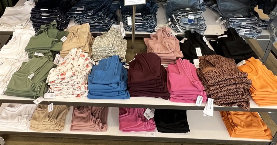 display table full of solid color tank tops