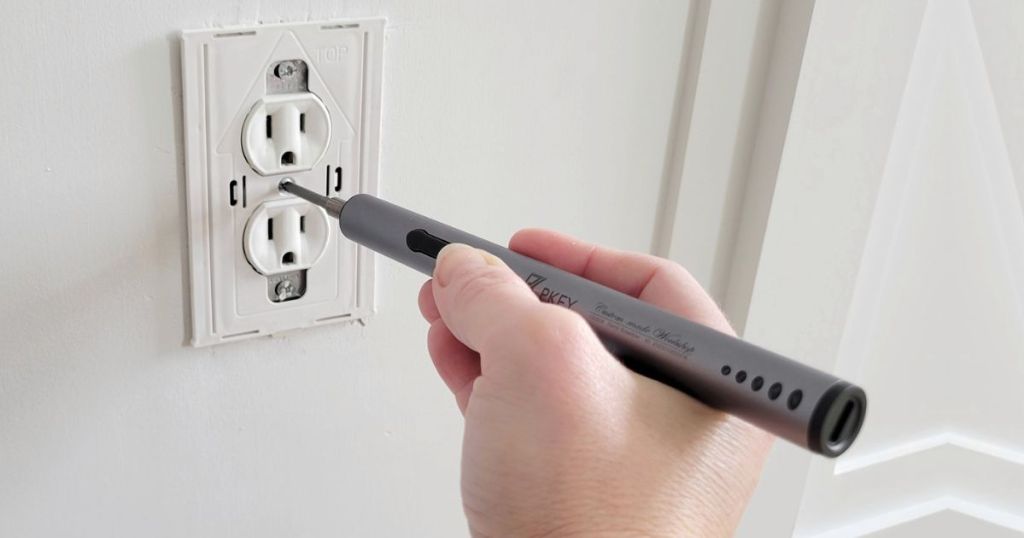 PKEY Electric Screwdriver being used to screw in an outlet