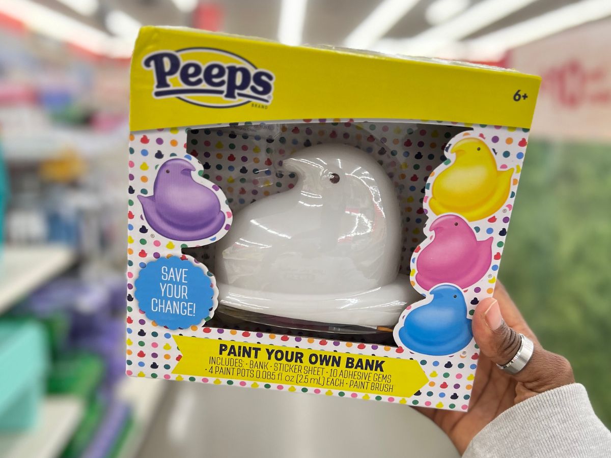 Hand holding up a peeps paint your own chick bank