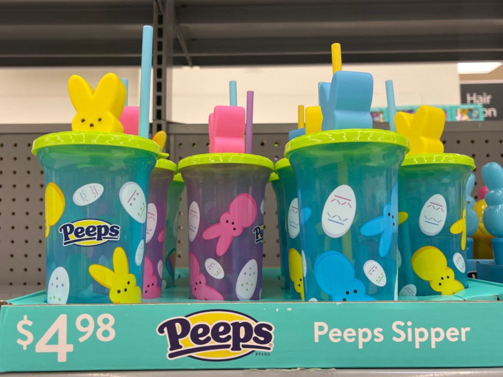 colorful kids tumbler with straw featuring a peep on top displayed at walmart store