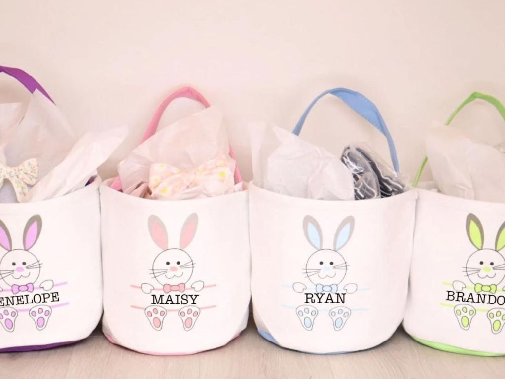 4 canvas baskets with colorful handles and bunny and personalized name on front