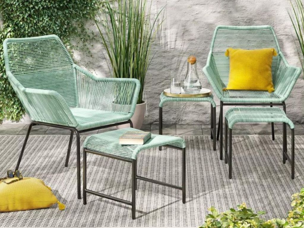 5 piece patio set with two chairs, two ottomans and a small matching table