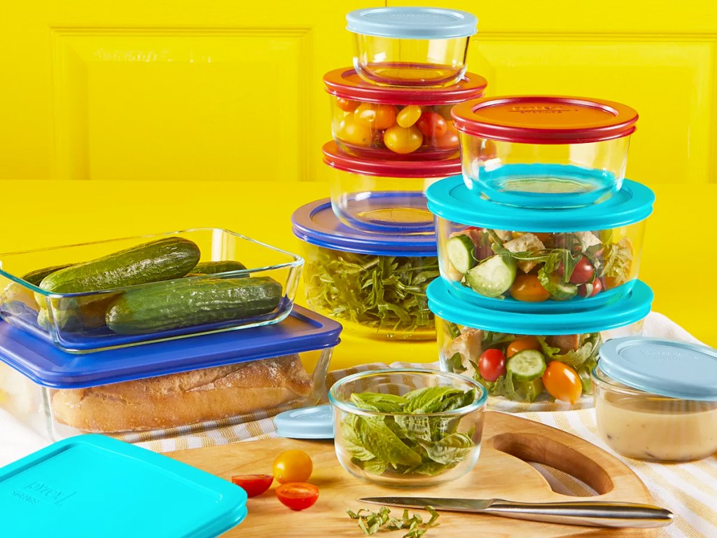 set of glass pyrex containers filled with foods