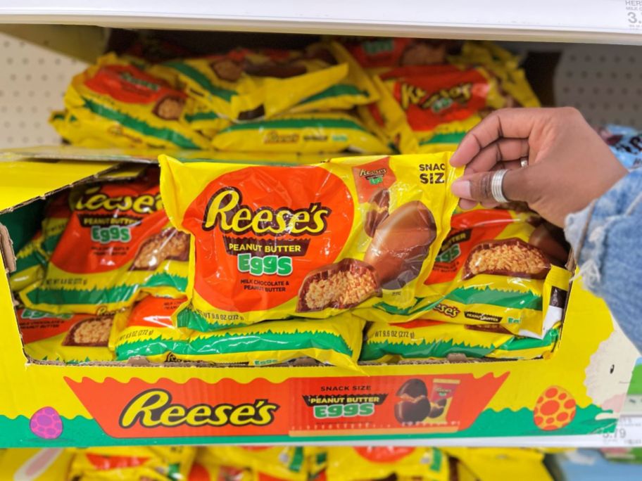Hand holding a bag of Reese's Peanut Butter Eggs