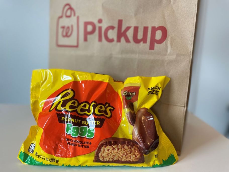 Bag of Reese's Peanut Butter Eggs next to a Walgreens paper bag
