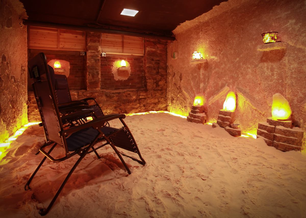 two chairs in a salt cave with salt lamps