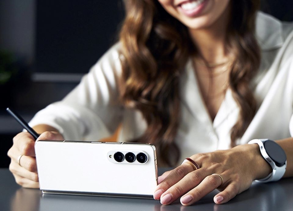 Woman looking at a Samsung smartphone