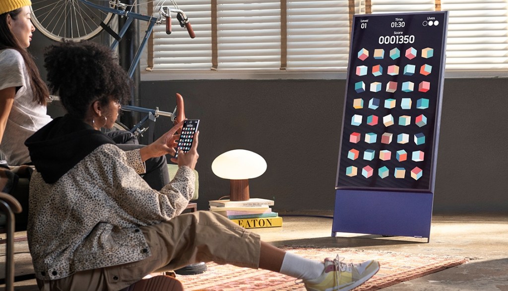 People looking at a large TV