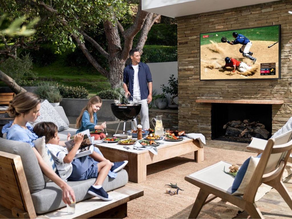 Family watching a Samsung Terrace Outdoor TV