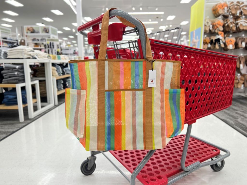 Striped mesh tote bag hanging on a Target cart