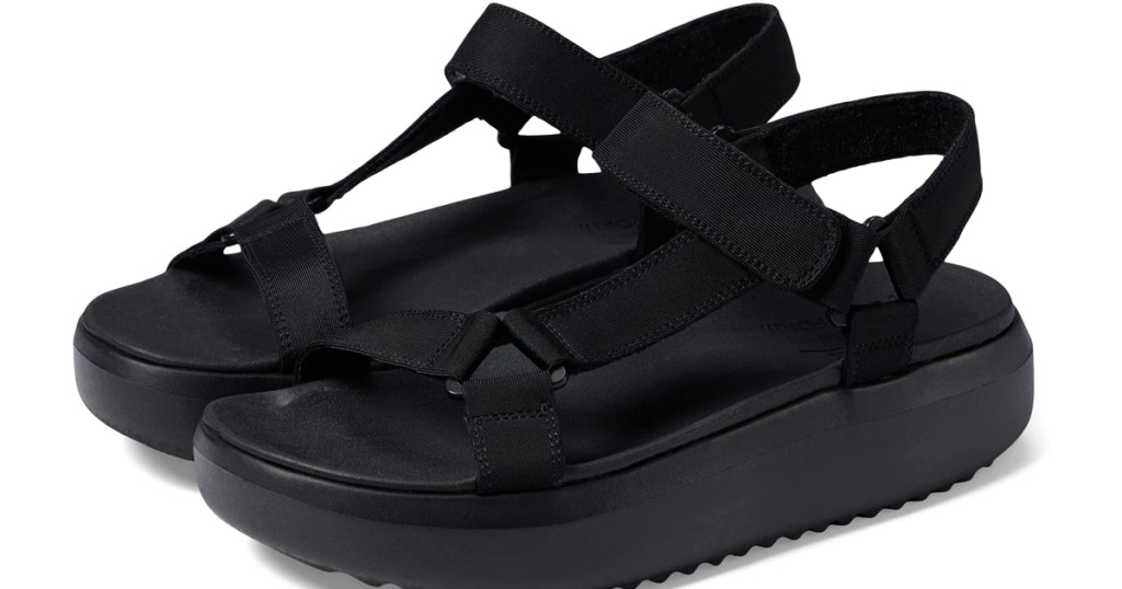 pair of black platform Skechers sandals