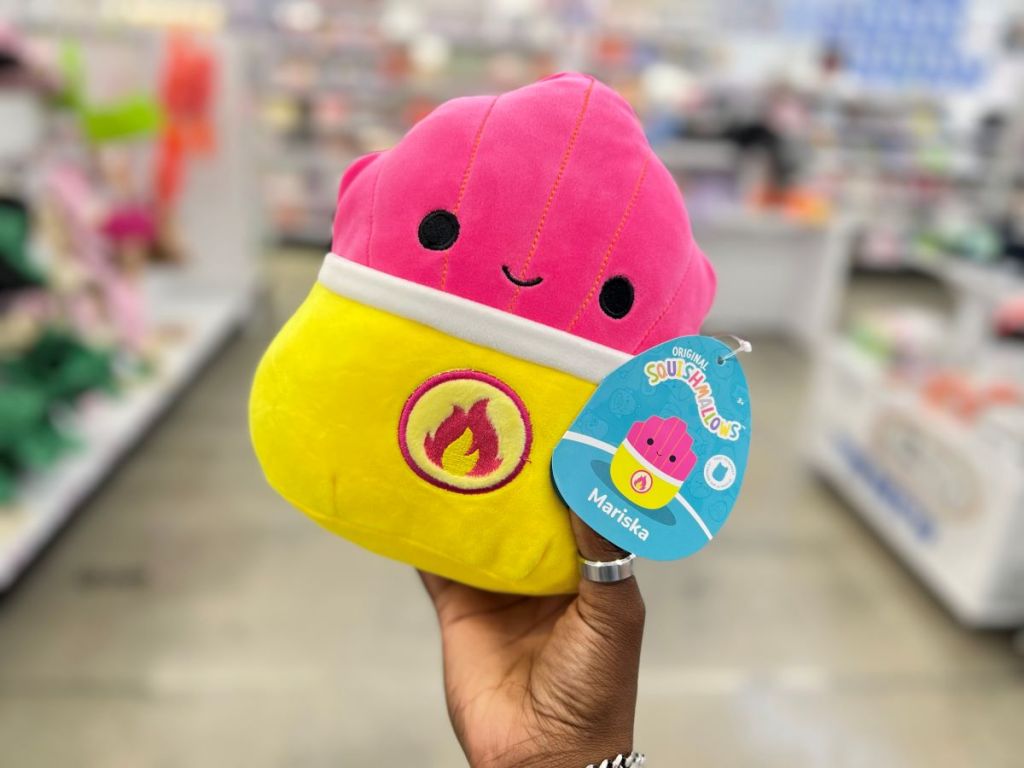 Hand holding a Squishmallow that looks like a container of hot fries