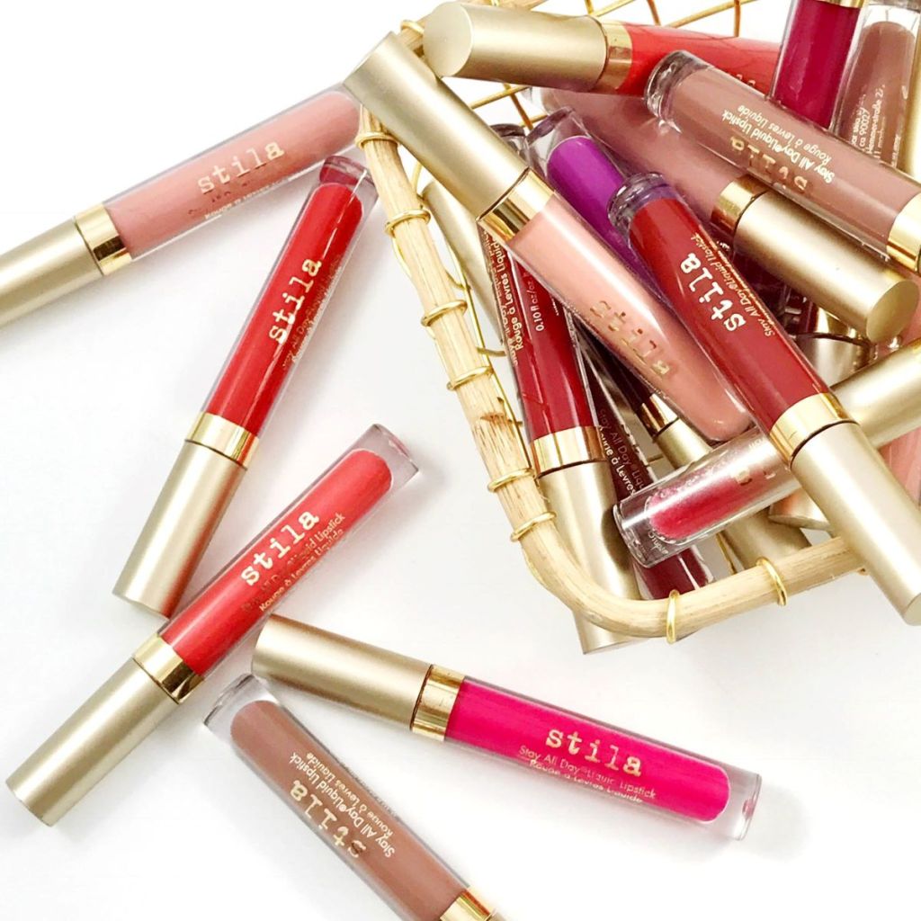Stila lipsticks in a basket and more next to the basket