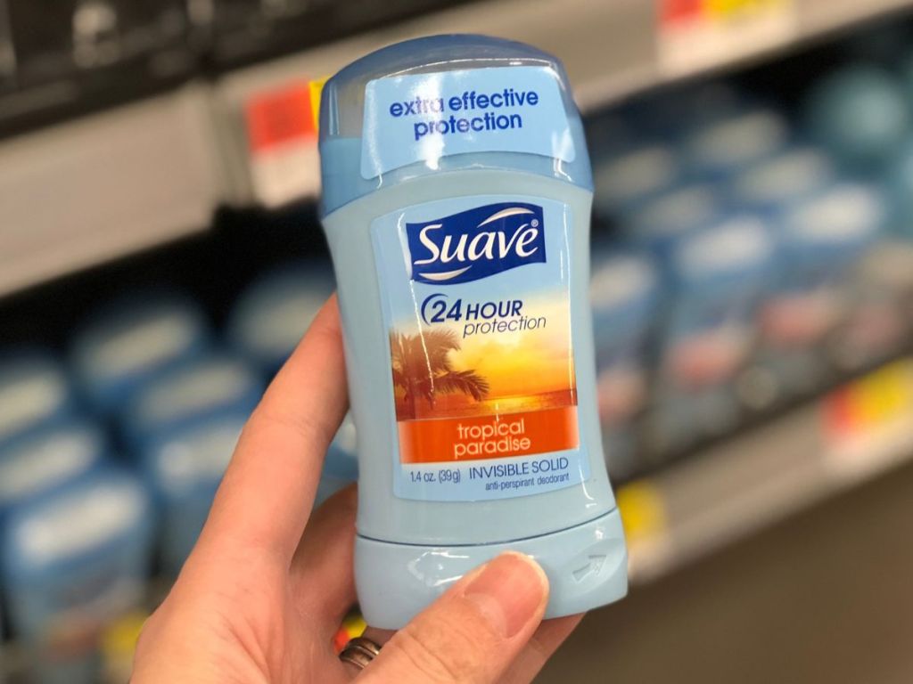 Small Suave deodorant held up in a hand