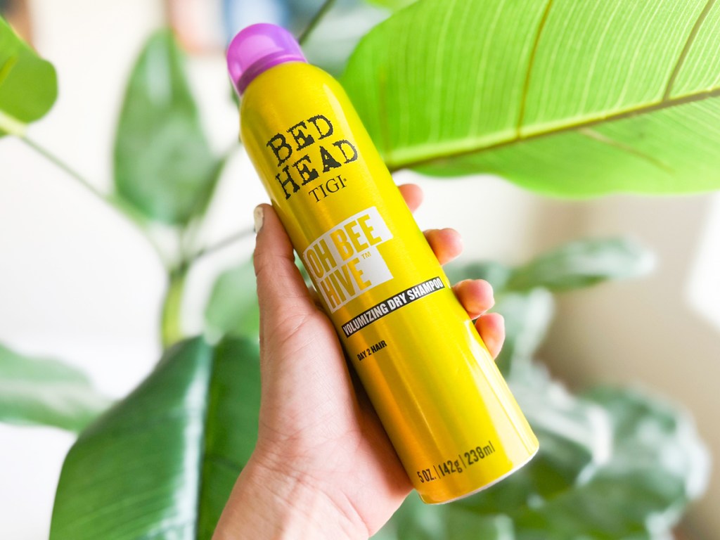 hand holding yellow can of TIGI Bed Head Oh Bee Hive! Matte Dry Shampoo
