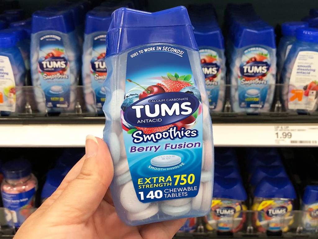 hand holding a bottle of tums smoothies