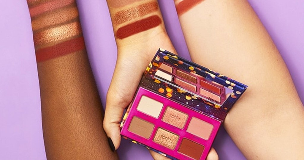 hand holding Tartelette Party Amazonian Clay Eyeshadow Palette