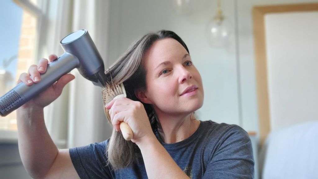 Woman using a tensky hair dryer