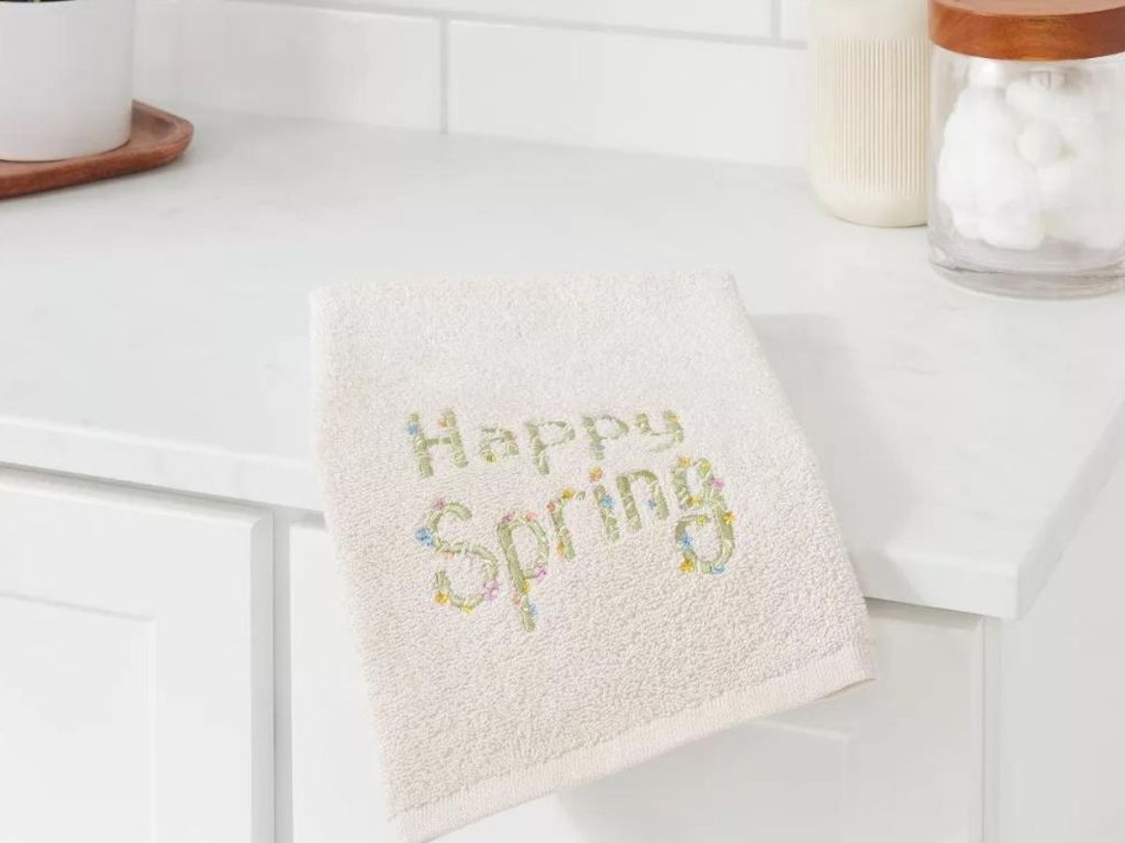 embroidered Happy Easter Hand Towel on a bathroom sink