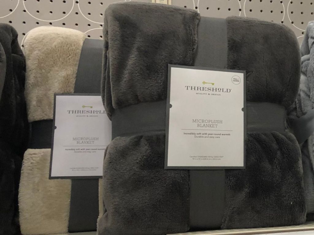 Threshold Microplush Blankets on shelf at Target