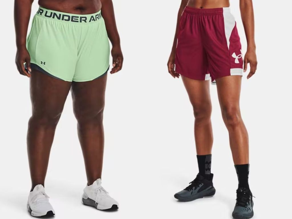 woman wearing neon green Under Armour shorts and woman wearing red and white Under Armour shorts