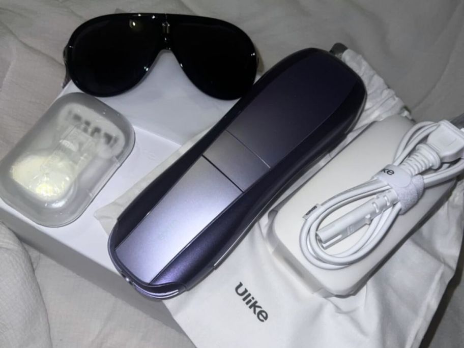 Ulike Air 10 Ice-Cooling IPL Laser Hair Removal Handset with protective eyewear, charging cord, and storage bag