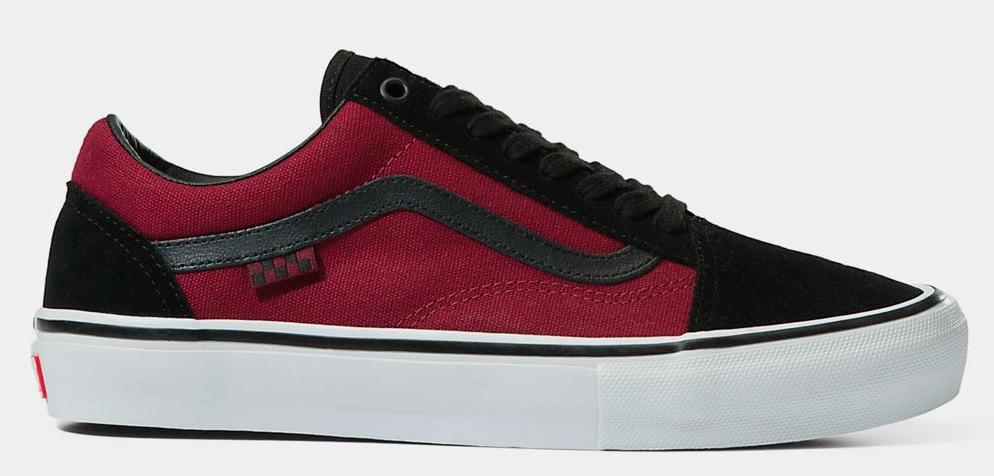 Red and black VANS sneaker with a white sole