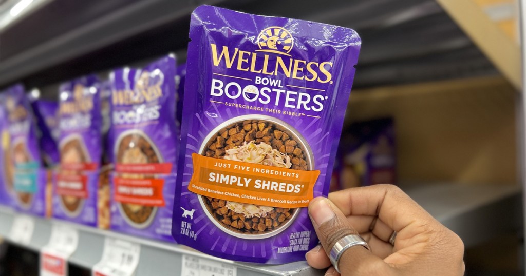hand holding packet of wellness bowl booster
