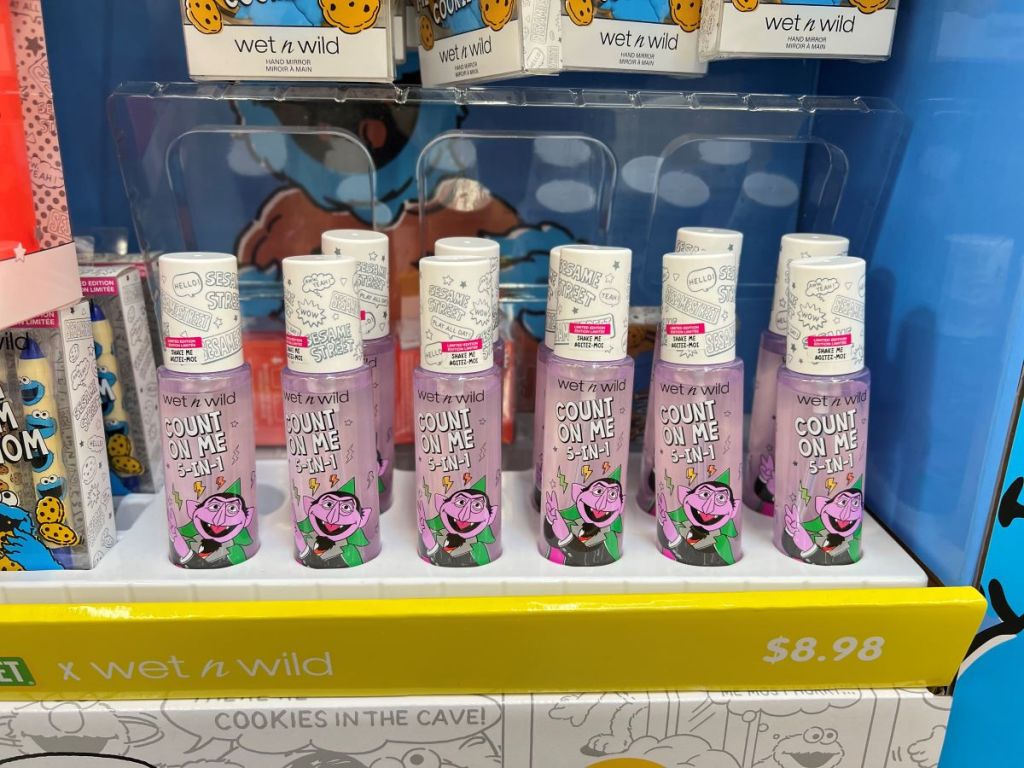 Display of Wet n Wild Face Mists that have Count from Sesame Street on them