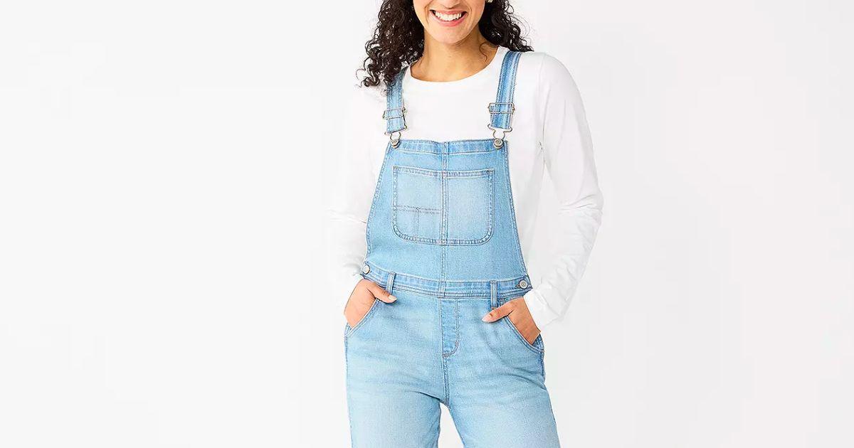 a model wearing a pair of Women's Sonoma Goods For Life Cropped Jean Overalls in a light wash