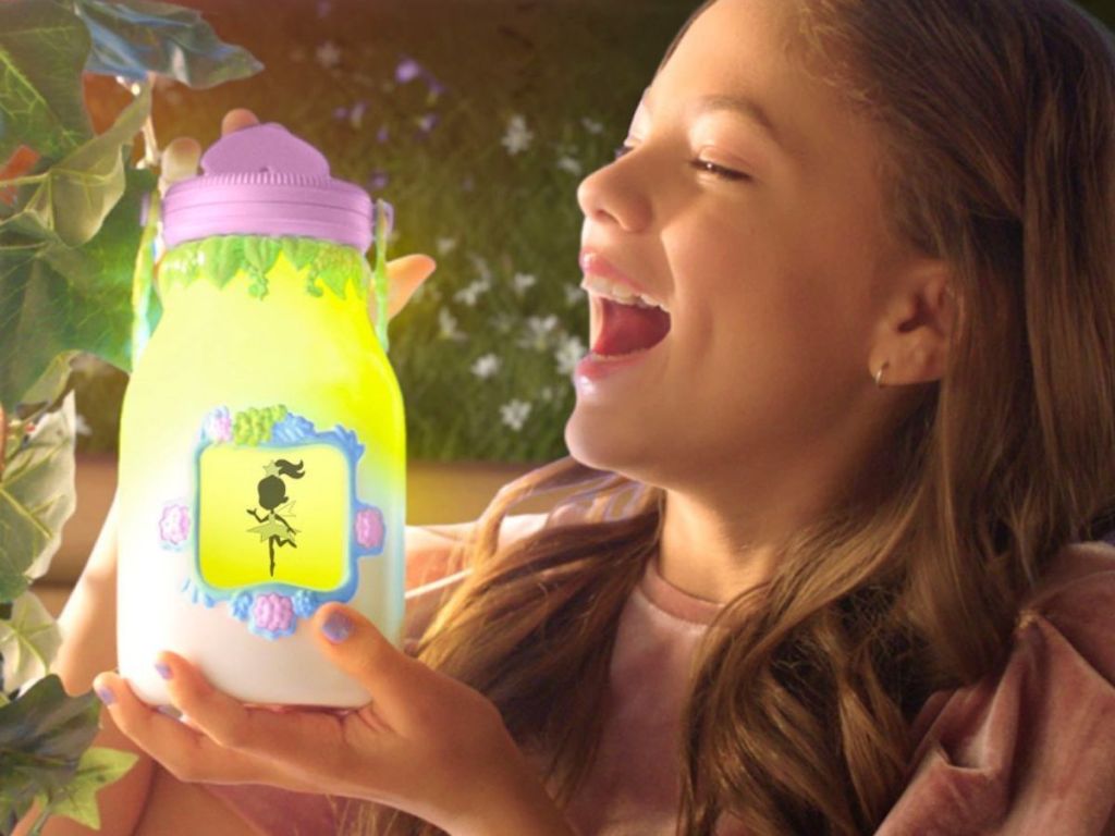 girl playing with light up fairy lantern