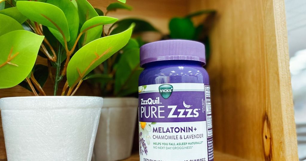 bottle of Zzzquil Pure Zzzs Melatonin+Chamomile & Lavender Gummies on shelf by plants