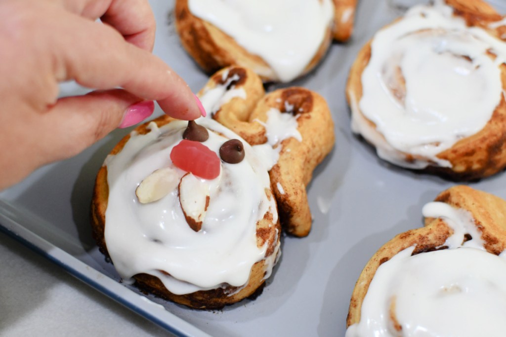 adding bunny face details to cinnamon roll easter bunnies