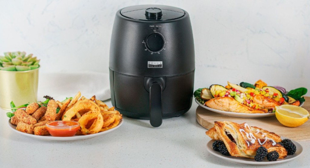 air fryer surrounded by food
