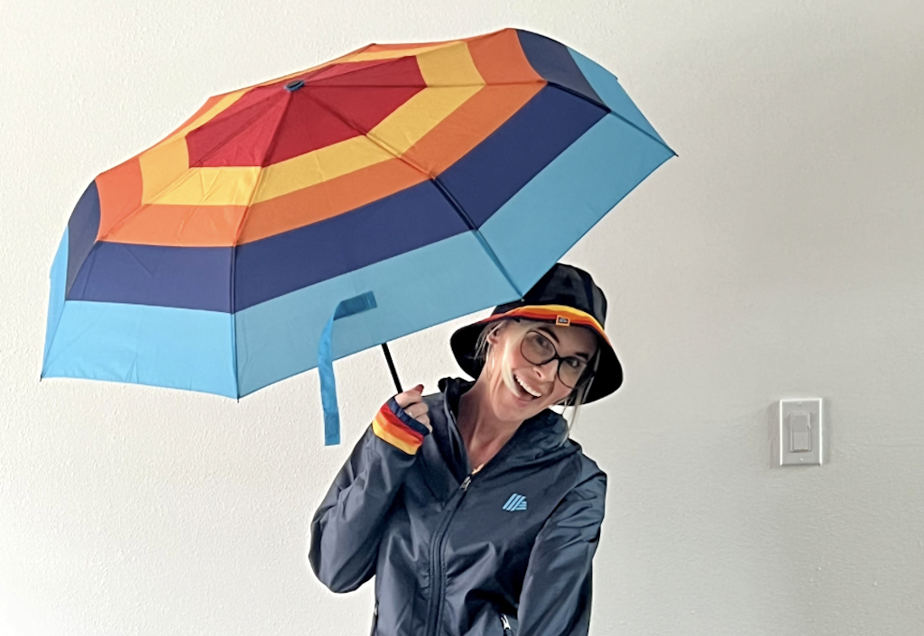 woman holding ALDI umbrella 