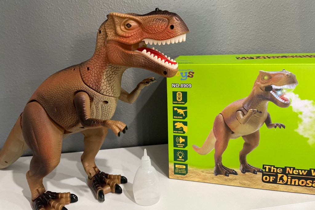 robot dinosaur toy next to box
