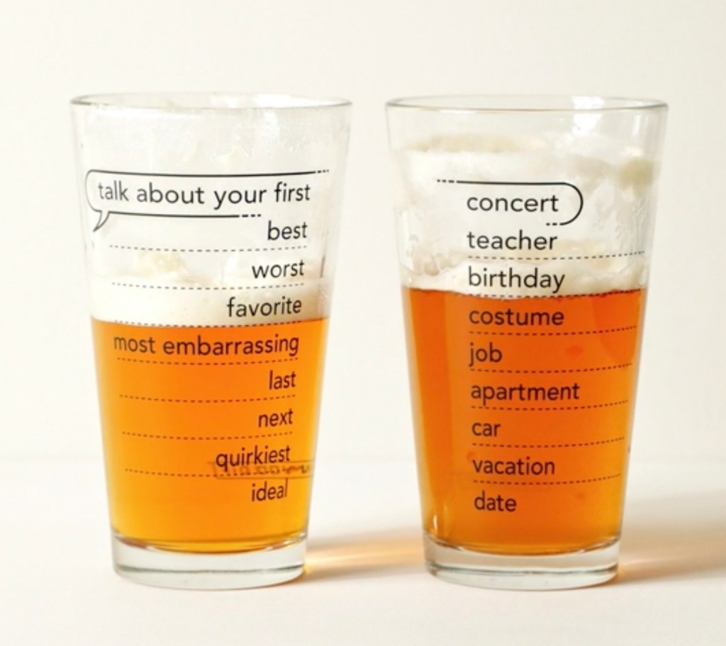 two beer glasses with conversation talking points printed on side
